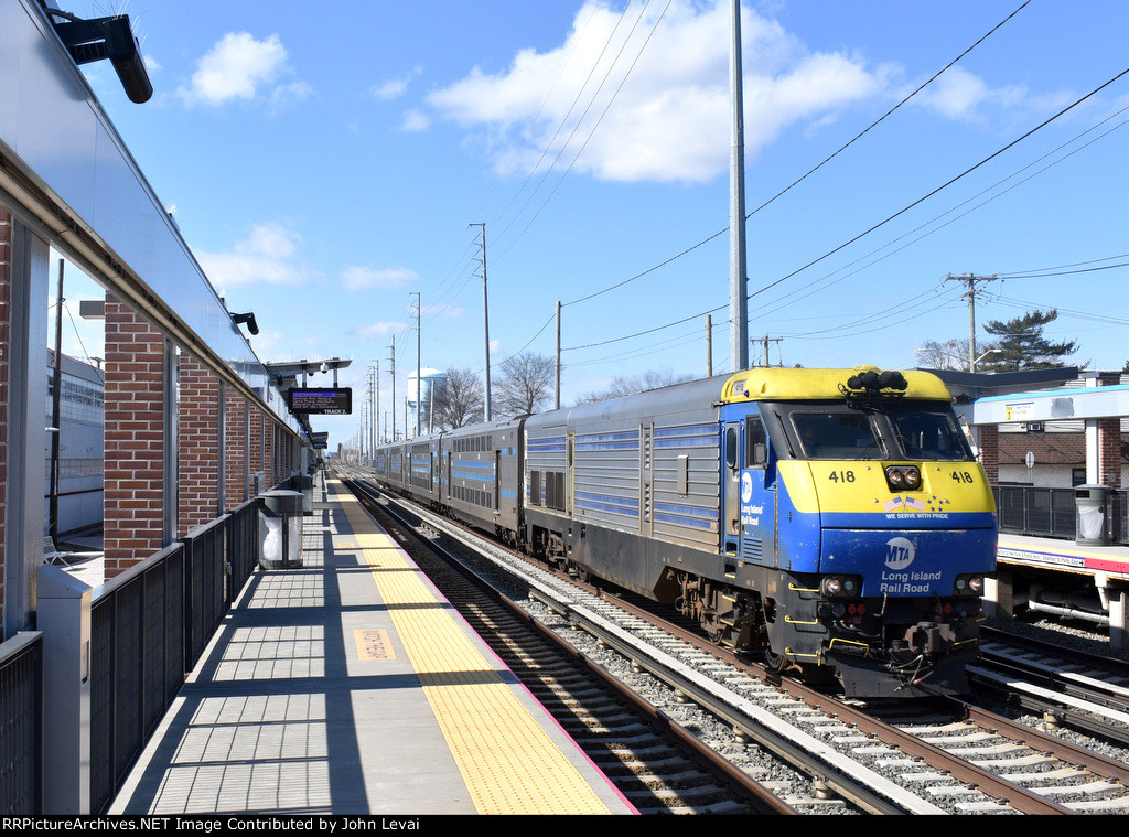 LIRR Train # 6512 with DE30AC # 418 pulling a four car C3 Bilevel Set 